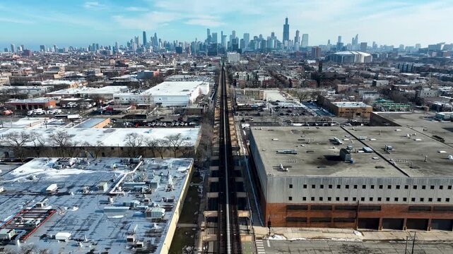 Cinematic 4K Drone Aerial Chicago Skyline Flying to Downtown Over CTA Green Line 'L' Train Tracks in Garfield Park