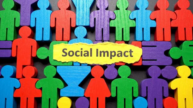 Hand holding social impact message over diverse figures. A compelling conceptual shot about human connection. Community development, global citizenship, positive change.