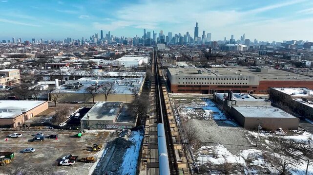 Cinematic 4K Drone Aerial Chicago Skyline Flying to Downtown Over CTA Green Line 'L' Train Tracks in Garfield Park