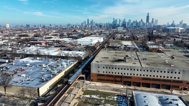 Cinematic 4K Drone Aerial Chicago Skyline Flying to Downtown Over CTA Green Line 'L' Train Tracks in Garfield Park