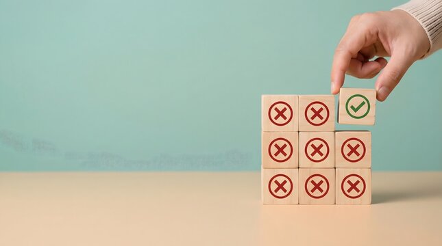 Hand placing correct block on incorrect cubes