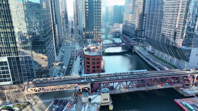Drone Flying Between Downtown Chicago River Skyscrapers, Sunny Winter Afternoon Aerial of The Loop, Cinematic 4K