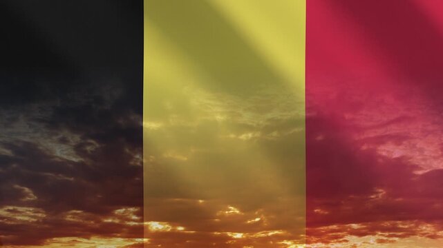 Flag of Belgium waving against a vibrant sunset, creating a patriotic and inspiring atmosphere with warm tones.