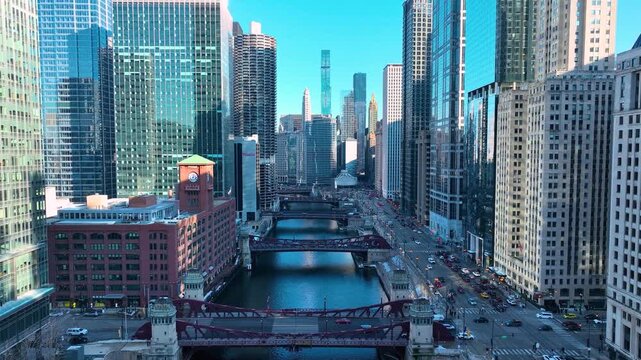 Drone Flying Between Downtown Chicago River Skyscrapers, Sunny Winter Afternoon Aerial of The Loop, Cinematic 4K