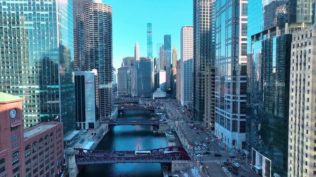 Drone Flying Between Downtown Chicago River Skyscrapers, Sunny Winter Afternoon Aerial of The Loop, Cinematic 4K