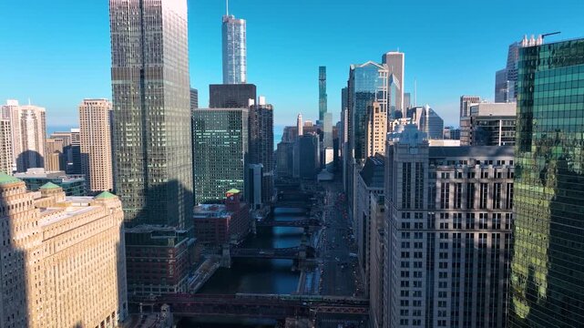 Drone Flying Between Downtown Chicago River Skyscrapers, Sunny Winter Afternoon Aerial of The Loop, Cinematic 4K