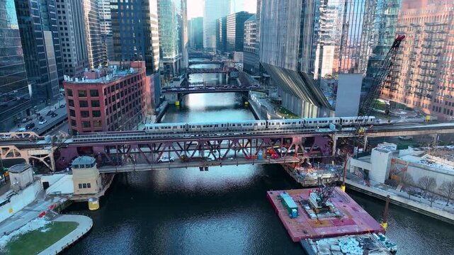 Drone Flying Between Downtown Chicago River Skyscrapers, Sunny Winter Afternoon Aerial of The Loop, Cinematic 4K