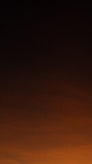 Dark amber and black vertical gradient background with smooth cinematic texture