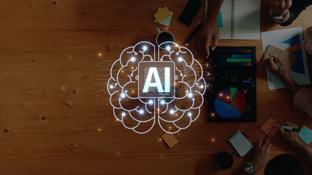 A top-down view of a collaborative brainstorming session with hands working on data analysis tools and an artificial intelligence graphic, showcasing teamwork and innovation. Raster
