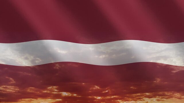 Flag of Latvia waving against a vibrant sunset, creating a patriotic and inspiring atmosphere with warm tones.