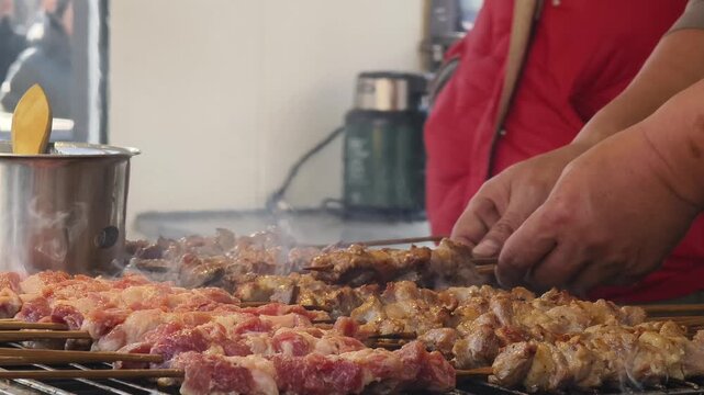 Closeup of preparing lamb skewers at street stall, Beijing, China