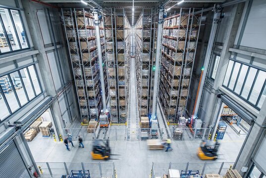 Automated warehouse with high-bay shelving and forklifts in operation