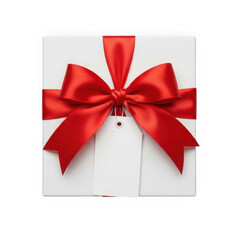 A white gift box with a beautiful red satin ribbon bow on top isolated on transparent background