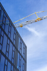 Office Building Glass Facade with Crane