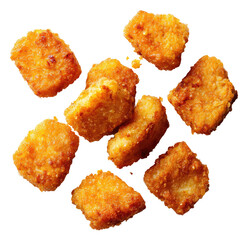 Fried, golden-brown, rectangular bites scattered on a black background