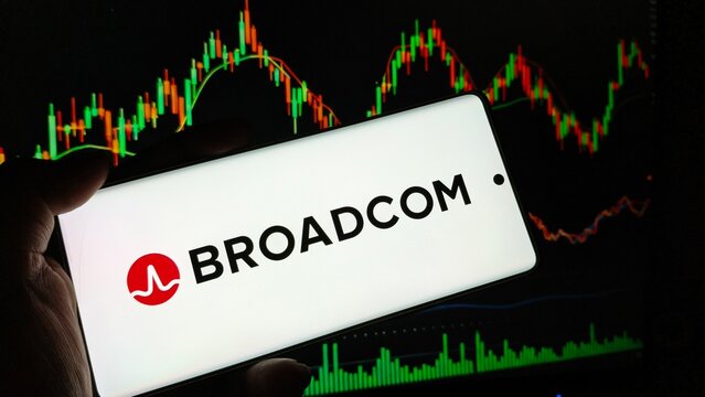 Close-up of hand holding smartphone with Broadcom logo on screen