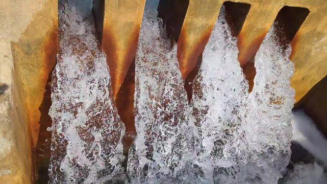 Dynamic water flow over spillway structure control system waterfall 4k video