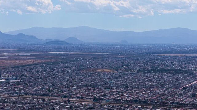 Wide drone panorama of northern Ecatepec during afternoon light