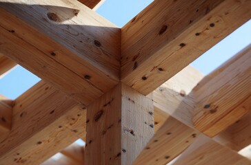 Close-up of wooden beams joint in modern timber construction. Natural wood structure, carpentry detail, sustainable architecture, eco building materials, structural design