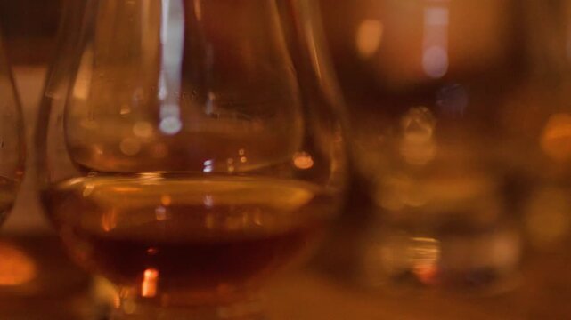 Close Up of Amber Whisky Glasses in a Warm Scottish Pub