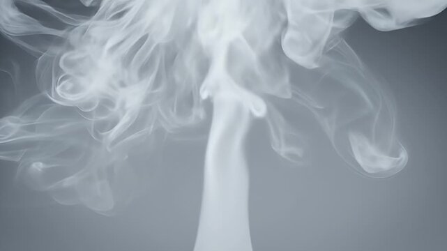 Abstract White Smoke Erupting Upwards Against a Subtle Grey Gradient Background with Soft Lighting Enhancing Delicate