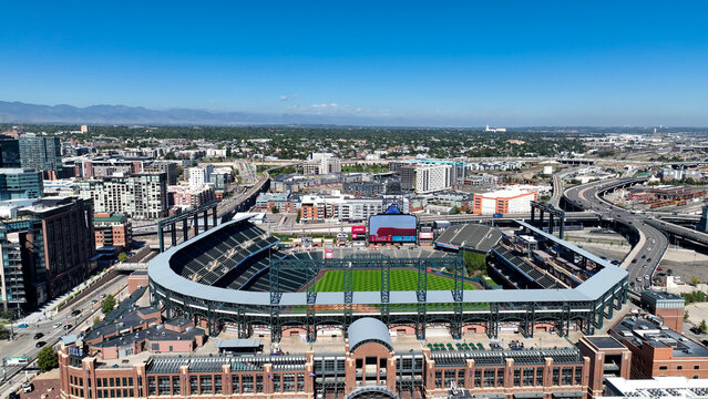 Aerial drone photo of Coors Field, the iconic home of the Colorado Rockies, located in downtown Denver, Colorado. This high-resolution image captures the expansive baseball stadium from above
