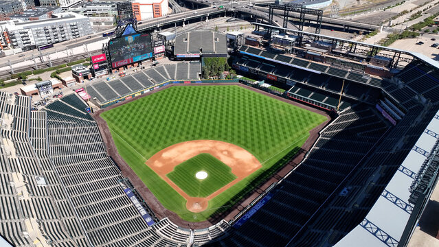 Aerial drone photo of Coors Field, the iconic home of the Colorado Rockies, located in downtown Denver, Colorado. This high-resolution image captures the expansive baseball stadium from above