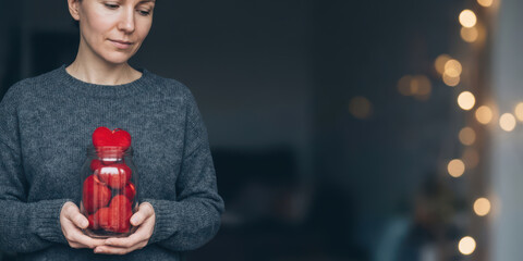Hand jar love emotion thank with gratitude bokeh light charity care holiday concept valentine gift nubes mood woman hold heart shape candy sweet tender scene