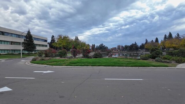 From a pedestrian angle, CSU Stanislaus appears welcoming and expansive, with tree covered walkways and active campus spaces that convey the character and atmosphere of the university environment