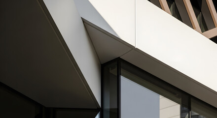 Close-up of a contemporary building facade, featuring a dynamic interplay of sharp angles, smooth white panels, and reflective glass, emphasizing modern minimalist architecture