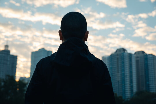 Focused bald woman looking forward in city