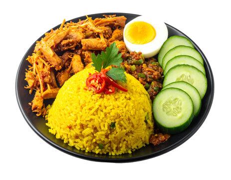 Indonesian dish of nasi kuning or yellow rice with stir-fried tempeh, shredded chicken, egg, cucumber, and chili sauce isolated on transparent png