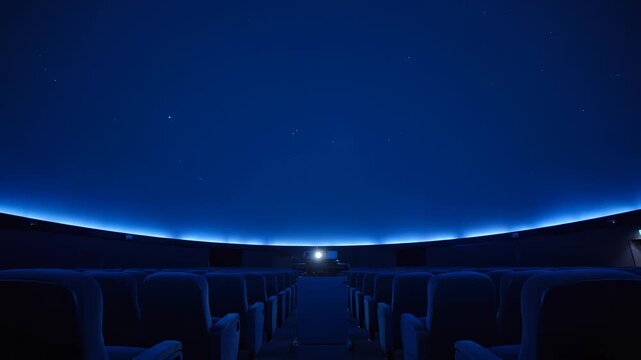 Empty Theater Seats Under a Starry Dome Projection