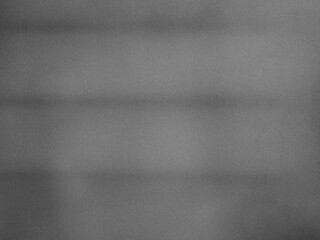 Monochrome abstract gradient texture with vintage film noise.