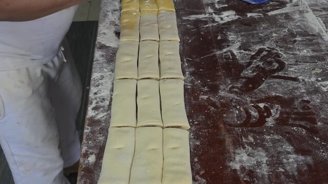 Glazing the sweet bread called chocolate taco with egg