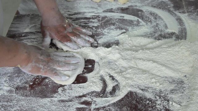 MAKING BALLS OF DOUGH FOR SWEET BREAD