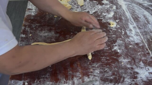  SHAPING THE DOUGH FOR THE SWEET BREAD CROISSANTS