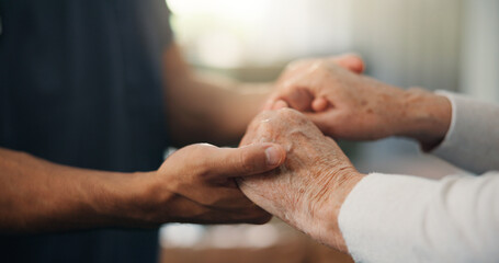 Caregiver, holding hands and comfort with senior person in home for empathy, support and medical results. Nurse, consoling or elderly patient for reassurance, healthcare diagnosis and assisted living