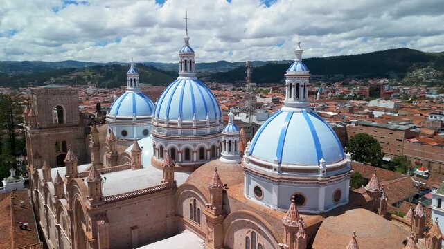 Slow cinematic drone orbit highlighting the architectural complexity of the New Cathedral featuring its Romanesque arches, truncated brick towers, and intricate rose window details in Cuenca