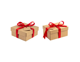 Obraz premium A gift box, wrapped in gold ribbon and tied with a beautiful bow, is placed on a white background