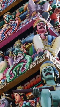 Vertical Close Up of Intricate Statues on Hindu Temple Tower