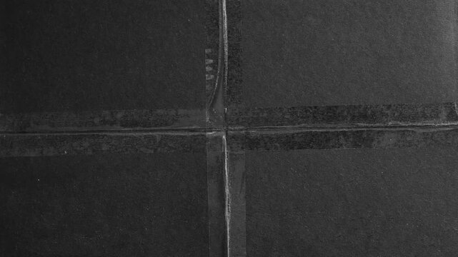 Black Paper Folded and Taped with Transparent Tape