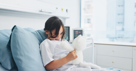 Teddy bear, healthcare and kid in hospital bed with comfort, support or recovery for surgery....
