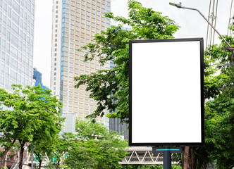 Outdoor black pole billboard with mock up white screen on footpath and clipping path for mock up