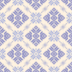 Fototapeta premium Light blue on beige background seamless knitted pattern with snowflakes design for carpet,curtain,clothing,fabric, wrapping paper, tiles,textiles,batik,texture and wallpaper.Vector background.