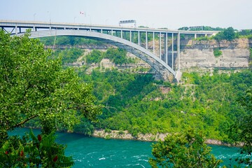 Fototapeta premium Lewiston-Queenston Bridge border crossing going over the Niagara Gorge and Niagara River in Niagara Falls, Ontario, Canada