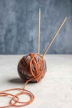 Multicolored yarn balls on a textured background