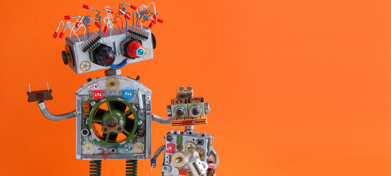 Steampunk design robotic family. Big robot electrical wire hairstyle, plug arm. Small kid cyborg with lamp bulb toy. Copy space, orange background.