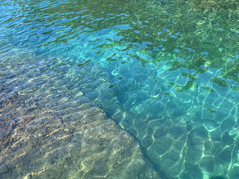 Mediterranean sea transparent water with algae.
