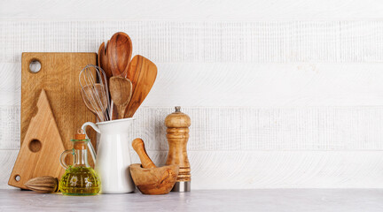 Kitchen utensils and spices on table